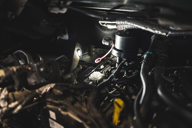 mechanic-removes-stuck-injector-diesel-engine-with-press-auto-repair-shop_609103-583